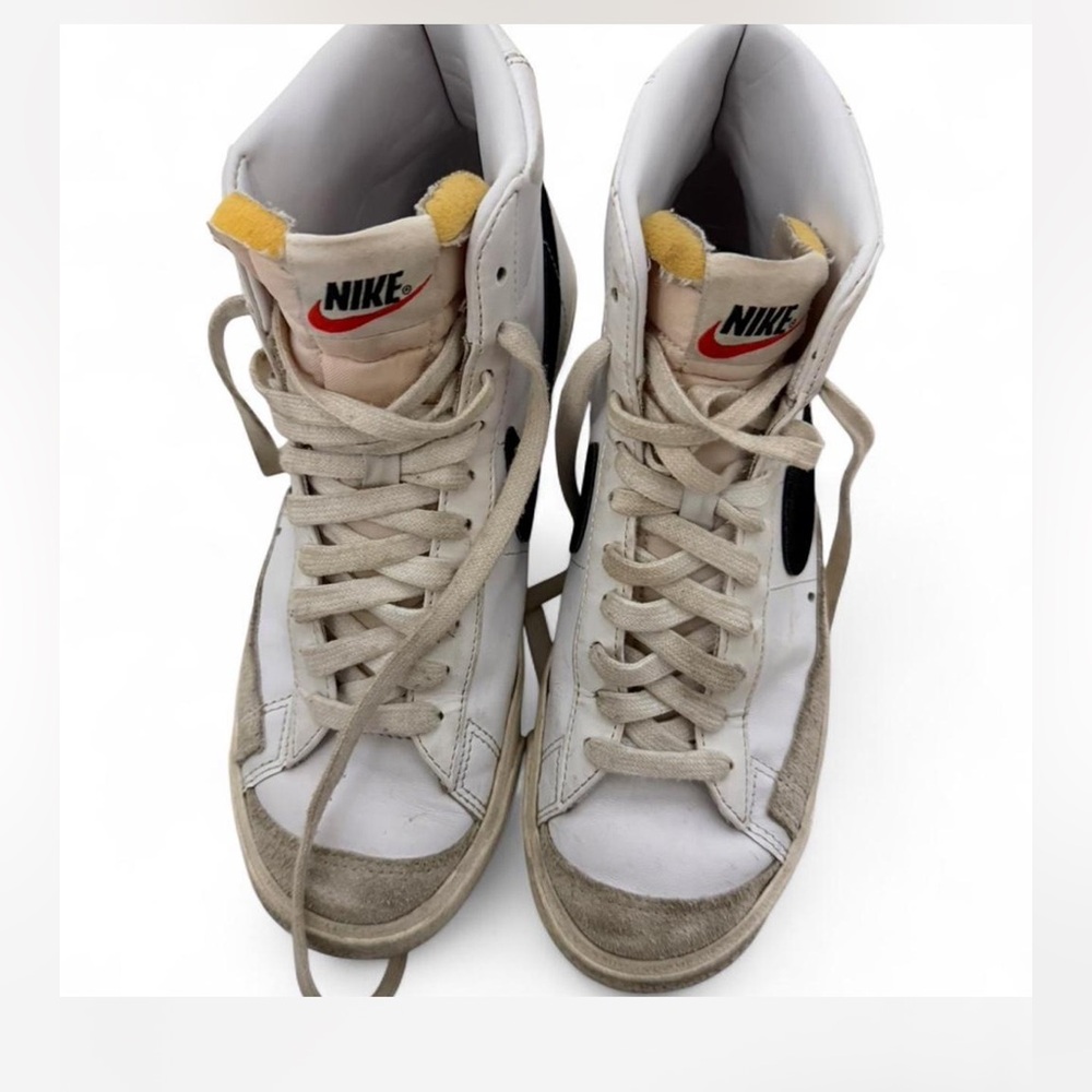 Nike White High-Top Sneakers with Black Swoosh